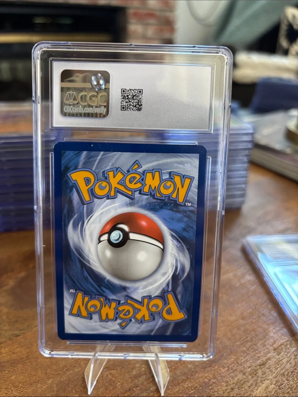 CGC 9 Espeon Holo Costco Exclusive 8 Tin Pokemon Prismatic Evolutions 033/131